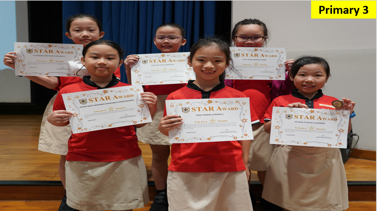 Six Primary 3 students in red uniforms smile while holding their Star Award certificates.